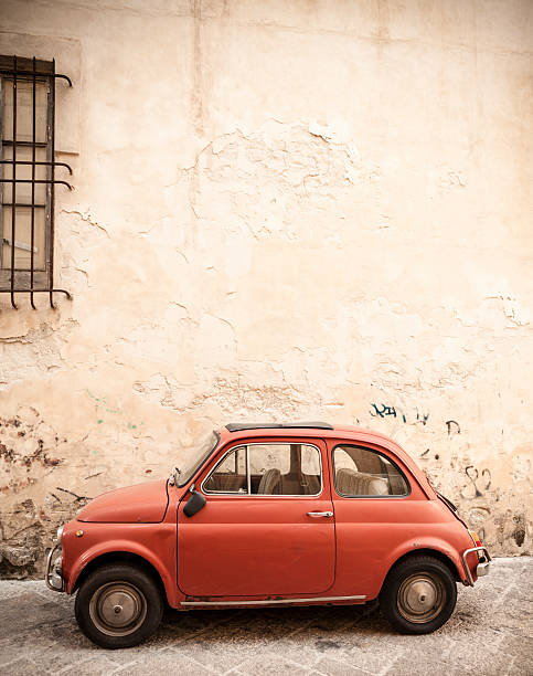 istock Tiny red vintage car in an alley, Lecce  Italy 184994330
