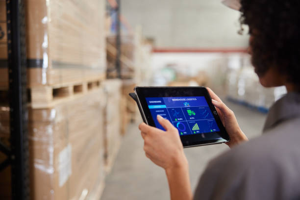 istock Female engineer tracking warehouse shipments with an app on a tablet 1849944244