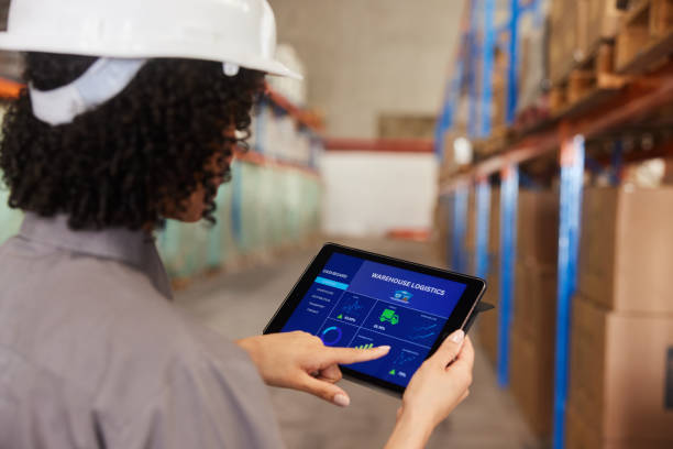 istock Female engineer using a tablet app to track shipments in a warehouse 1849949333