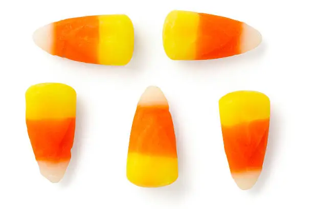 "5 Candy corn isolated on white background at different angles with matching drop shadows.  Color corrected, exported 16 bit depth, retouched and saved for maximum image quality."