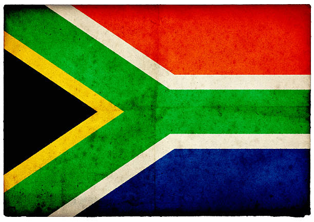 A South Africa flag on rustic old wood surface background