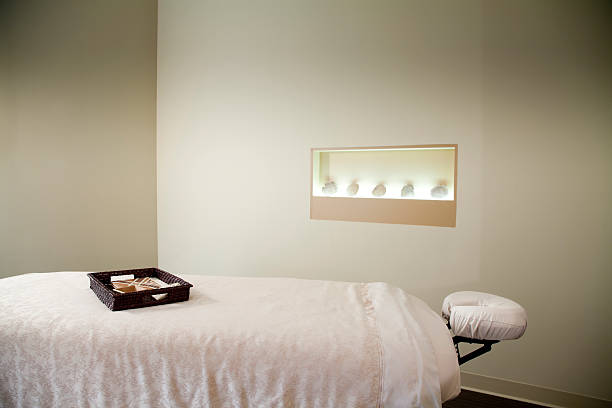 Massage Table A massage table in a spa. spa room stock pictures, royalty-free photos & images