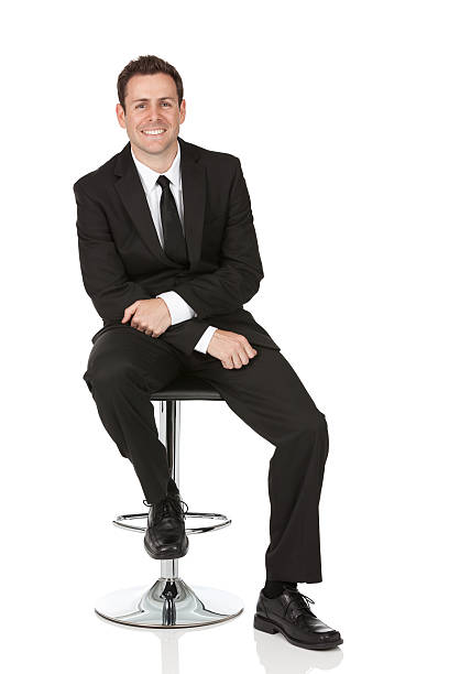 istock Happy businessman sitting on a chair 184995881