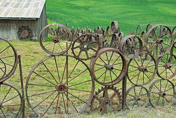 istock Tractor wheel fence and barn 184996041