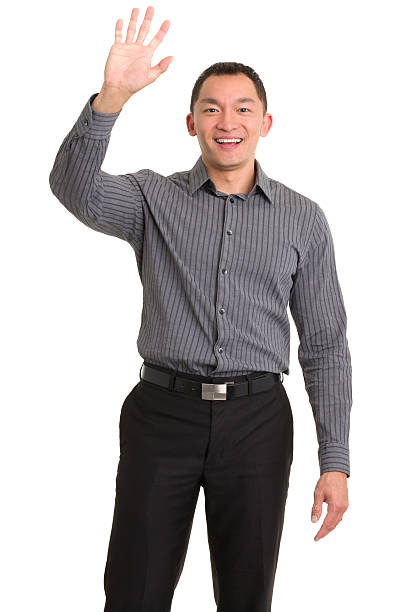 Excited Asian Man Waving Hello stock photo