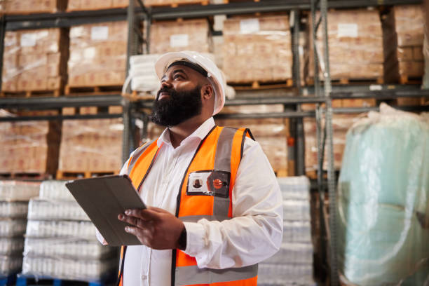 istock Male engineer using a tablet to trace shipments in a distribution warehouse 1849961067