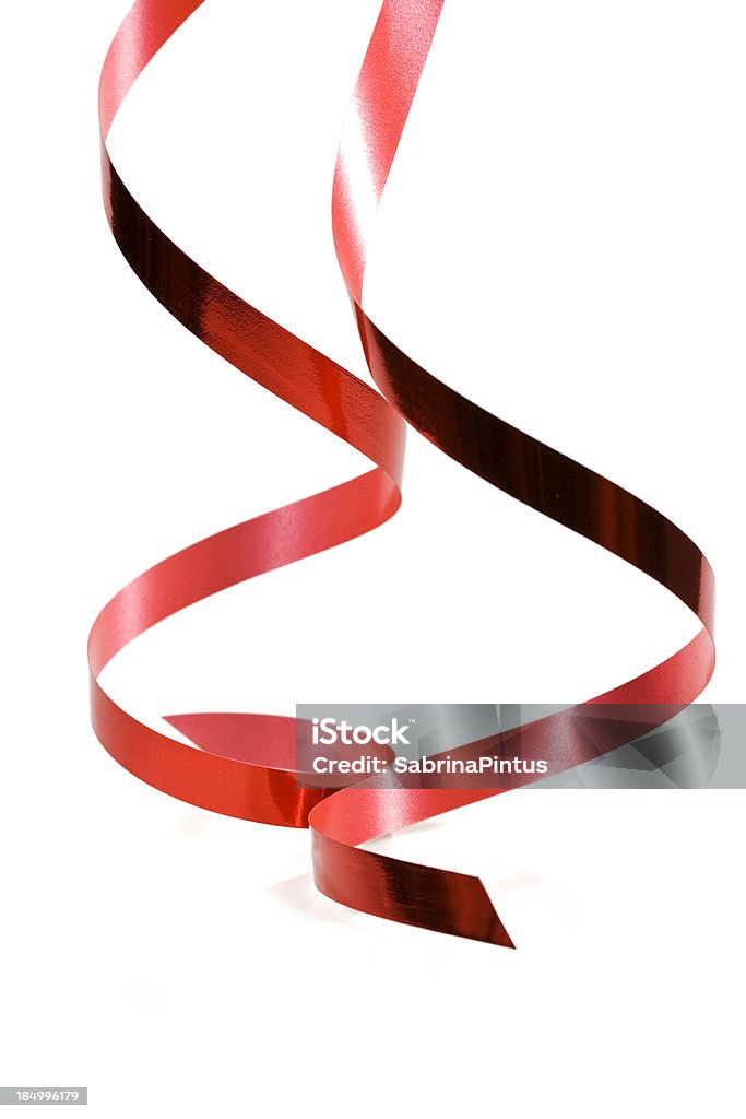red ribbon hanging  down Ribbon - Sewing Item Stock Photo