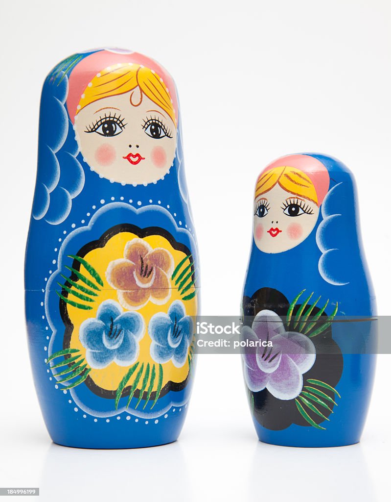 Matrioska dolls Two matrioska dolls in different sizes Contrasts Stock Photo