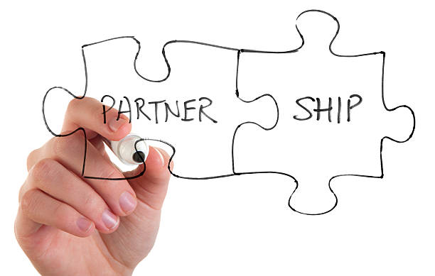 istock Woman drawing a partnership jigsaw concept 184996280