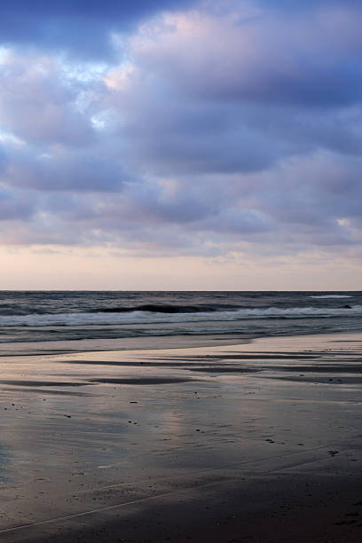 istock moody sky and its reflection in the water 184996707