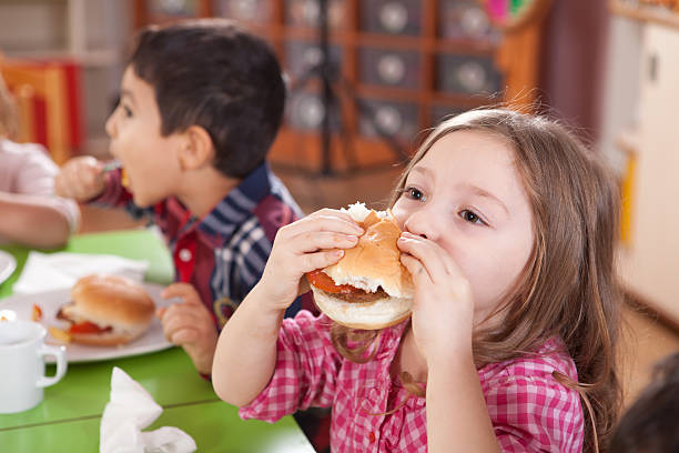 istock Little Girl and Hamburger 184997162