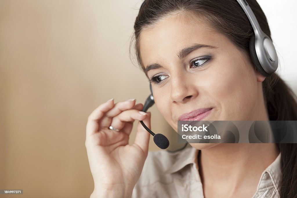 Customer service representative Young smiling receptionist listening. Soft focus. Adult Stock Photo