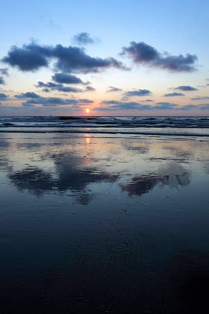 istock moody sky and its reflection in the water 184997861