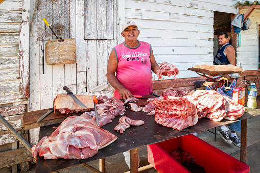 Trinidad, Cuba - March 22, 2017: A man sells pork on the streets of Tinidada