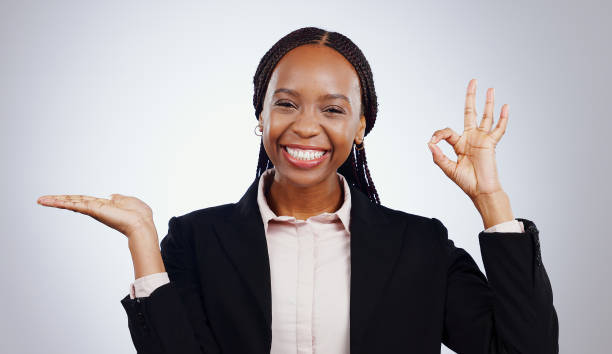 istock Space, portrait or black woman with perfect hand sign for support, agreement or feedback. Studio, happy or business person on grey background with smile or okay gesture for approval, like or yes 1849979270
