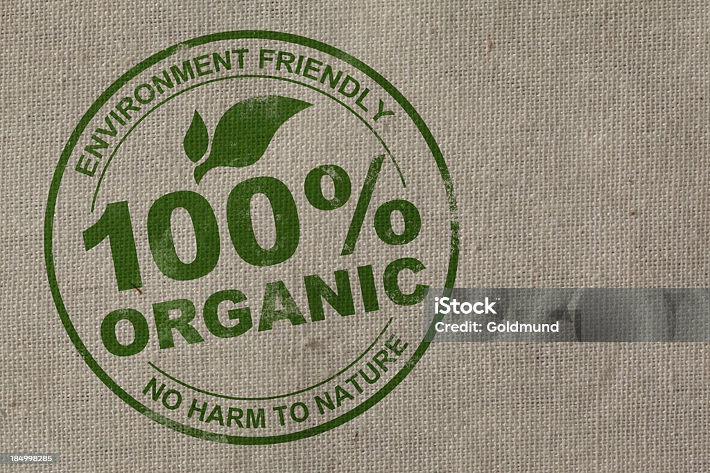 100% Organic Stamp 100% organic stamp on natural cotton fabric. 100 Percent Stock Photo