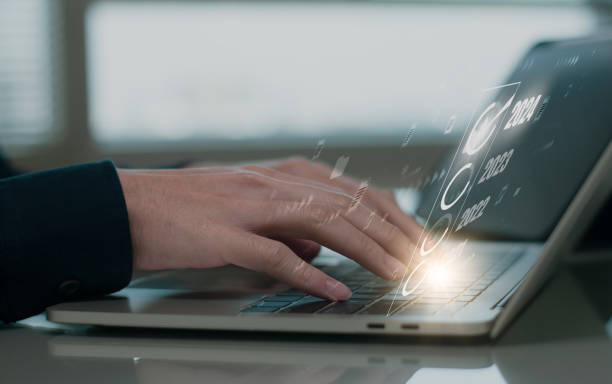 istock Businessman using computer start on 2024 year number calendar start happy new year, concept planning, goal, challenge, celebration ,new year resolution trends, industry and business trend of world 1849989997