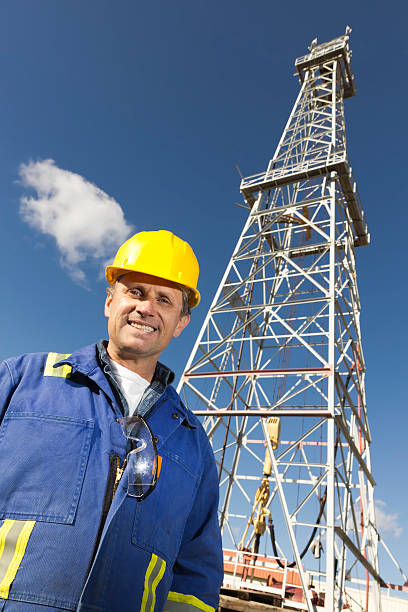 istock Oil Rig and Laborer 184999016