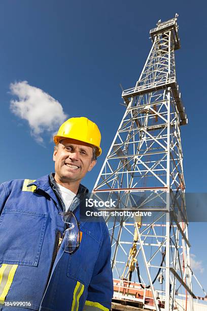 Oil Rig And Laborer Stock Photo - Download Image Now - Engineer, Gasoline, Blue-collar Worker
