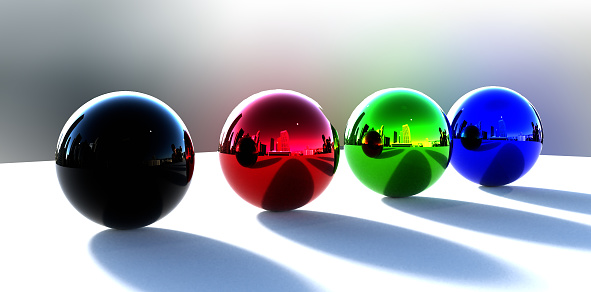 Colorful Chrome balls on a table with a blurry background