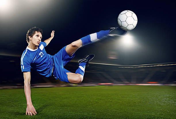 istock football player volleying ball 184999436