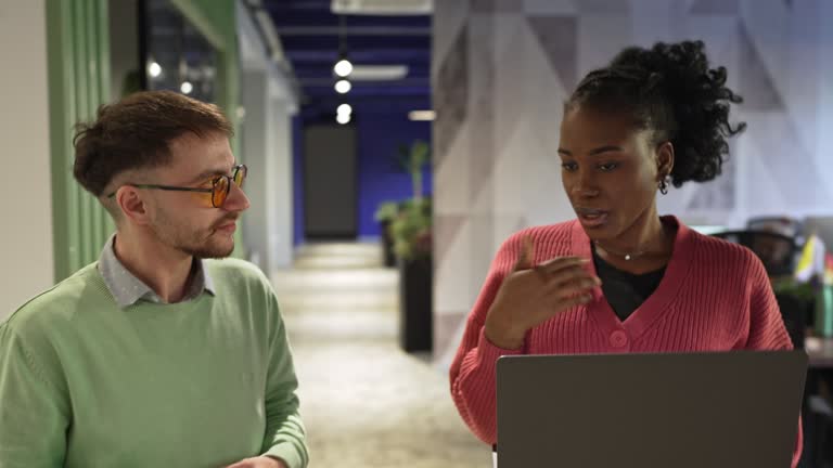 Woman talking with her colleague in the modern working space