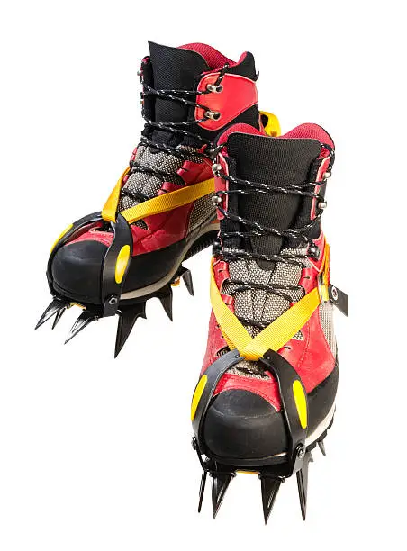 hiking boots with crampons isolated in white (clipping path added)