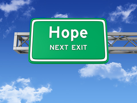 Road Sign with HOPE and Sky