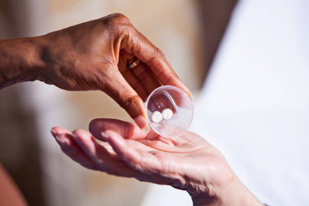 istock Hand of nurse giving patient medication 185000819