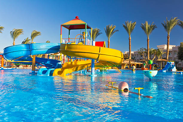 аквапарк в роскошный тропический курорт - water park inflatable ring water swimming pool стоковые фото и изображения