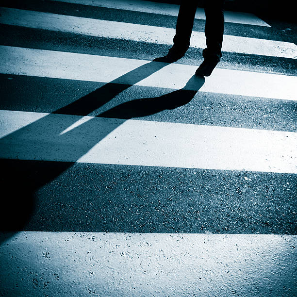 istock Solitary Shadow Crossing the Street 185001137