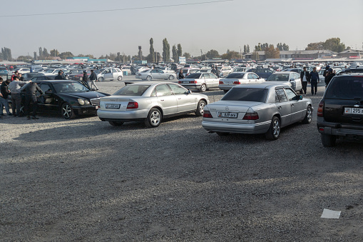 Bishkek, Kyrgyzstan at October 16, 2022: Large used car open air market RIOM Auto