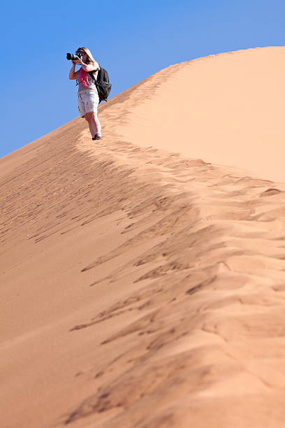 istock Female Photographer on Sand Dune 185001390