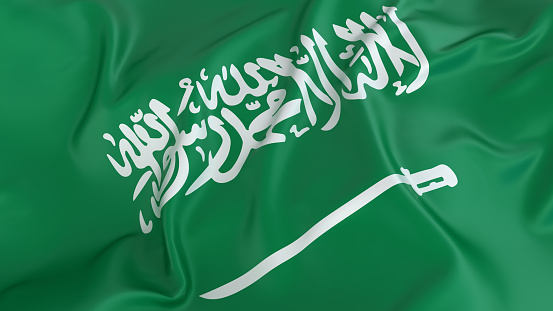 Saudi Arabian flag in cloudy sky. Waving in the sky