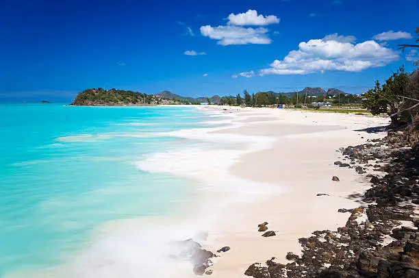 Beautiful Ffryes Beach in Antigua with rocks in the foreground and slightly blurred motion.Find more images from Antigua and the Montserrat Volcano in my Lightbox: