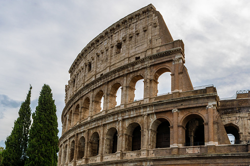 People are standing in front of the Colosseum in Rome in Italy in July 2015.