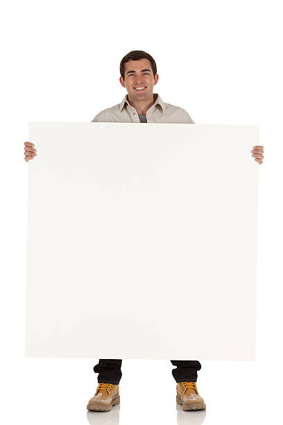 istock Happy man holding a placard 185002762