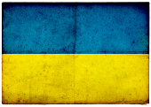 Grunge Ukraine Flag on rough edged old postcard