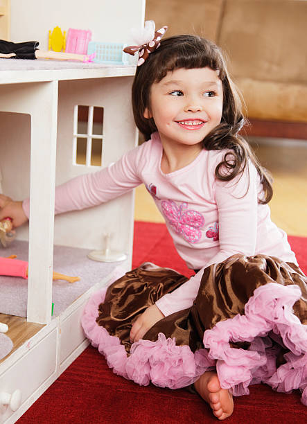 istock Little Girl with Dollhouse 185003119