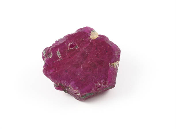 Rugged ruby gem stone on a white background stock photo