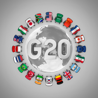twenty office chairs with flags of g20 countries and earth in the center.3d render.Map:http://visibleearth.nasa.gov/view_rec.phpid=8392