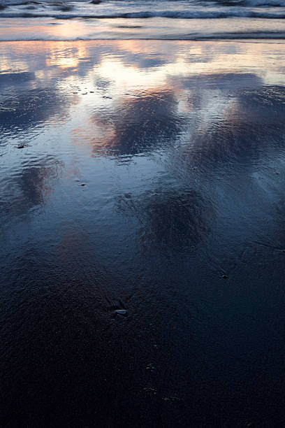 istock reflection of a moody sky in the water 185003625
