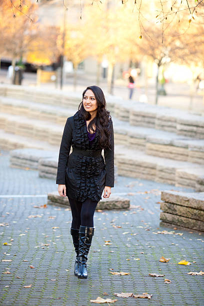 istock Young Hispanic Woman Walking Downtown 185004369