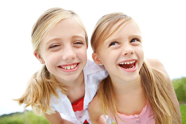 istock Sisters having fun in the summer sun 185004371