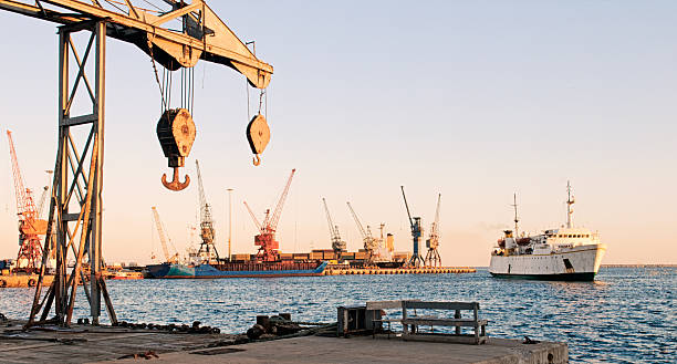 Cargo ships at Mersin port in Turkey Cargo ships and port cranes level luffing crane stock pictures, royalty-free photos & images