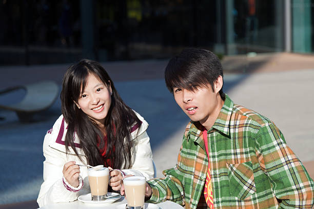 young couple drinking coffee in the dating