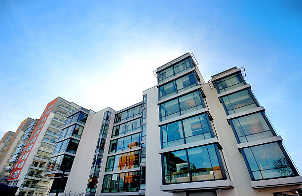 istock Apartment building against blue sky 185004850