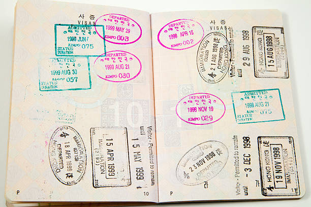 istock Open passport with departure and entry stamps 185005159