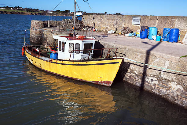 Small fishing boat moored in the port of Bocca di Magra village, Liguria, Italy, Europe
