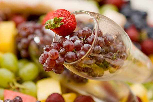 istock Fruit grapes mango kiwi in wineglass 185006161